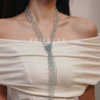 Model wearing FFIENLEE 925 sterling silver Italian lace necklace with Swarovski aqua crystal beads in knot style — tied loosely at the chest with the tail draping down, styled with a white off-shoulder dress, editorial and elegant look, FFIENLEE branding