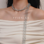 Model wearing FFIENLEE 925 sterling silver Italian lace necklace with Swarovski aqua crystal beads in single-wrap style — looped once around the neck with one long end draping down the chest, styled with a white strapless dress, FFIENLEE branding