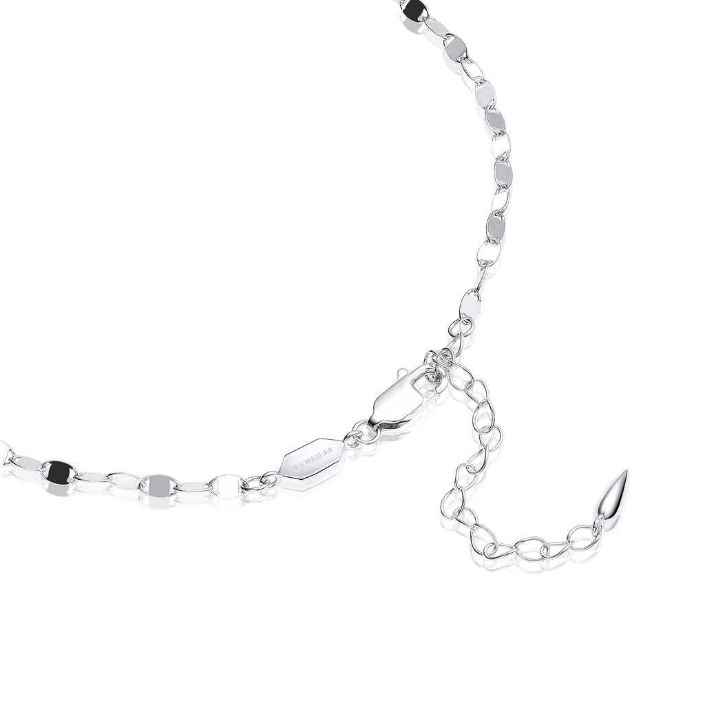 Close-up detail of FFIENLEE 925 sterling silver Y-lariat necklace in rhodium silver tone, showing lobster claw clasp, branded hexagon tag, and extension chain with teardrop end on white background