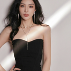 Model wearing FFIENLEE 925 sterling silver Y-lariat tile chain necklace in silver rhodium tone with matching tassel earrings, styled with a black strapless dress, showcasing the décolletage-accentuating drop design